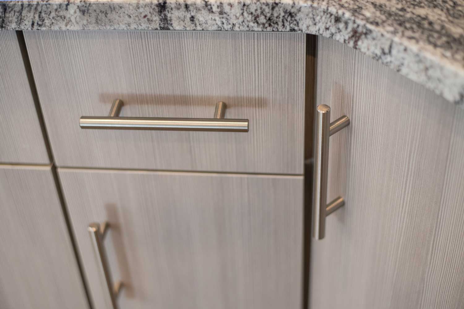 close up of silver colored cabinet handles
