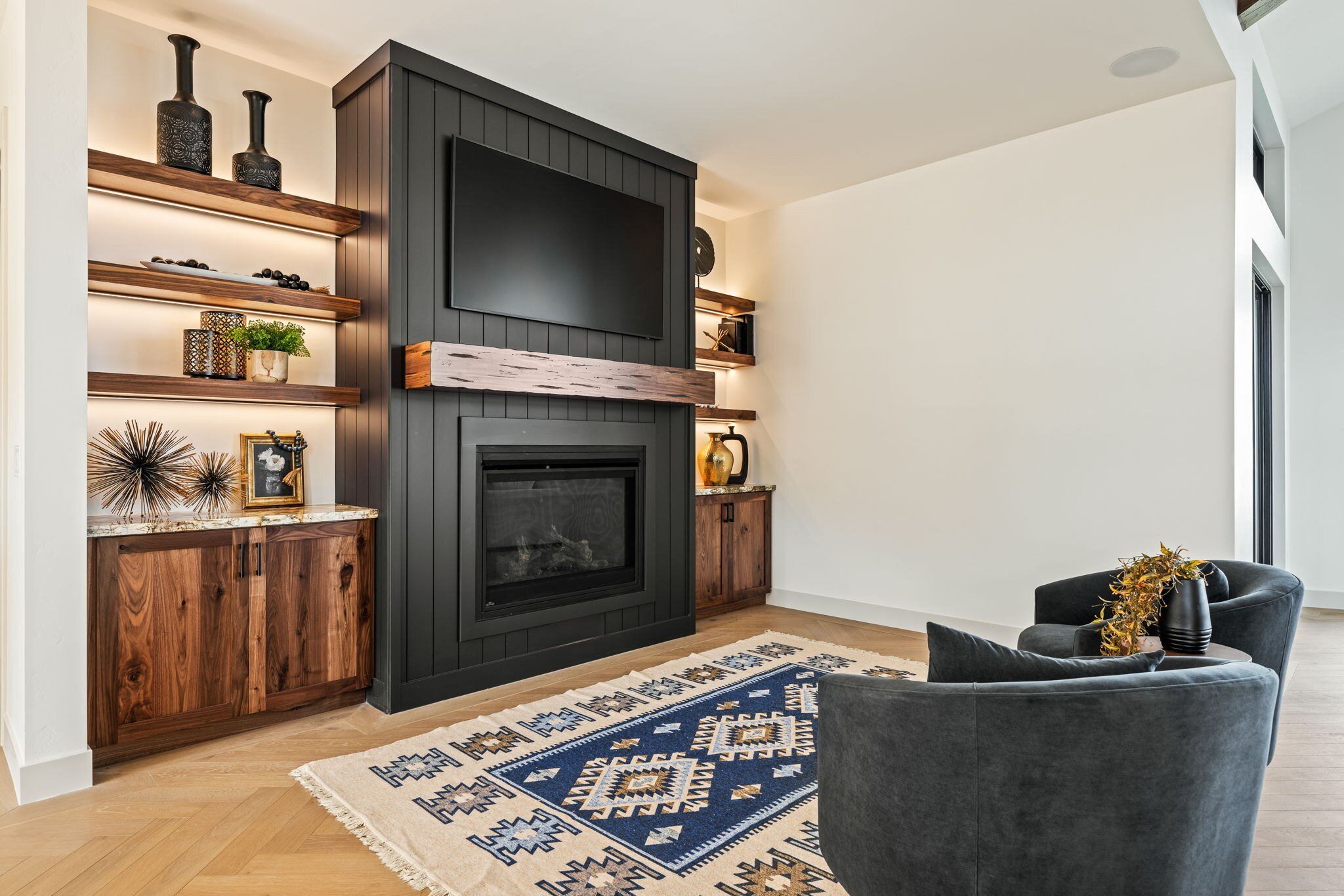 Fireplace area with warm lighting and unique decor in a custom mountain lodge home in Brian Head, UT by Choice Builders