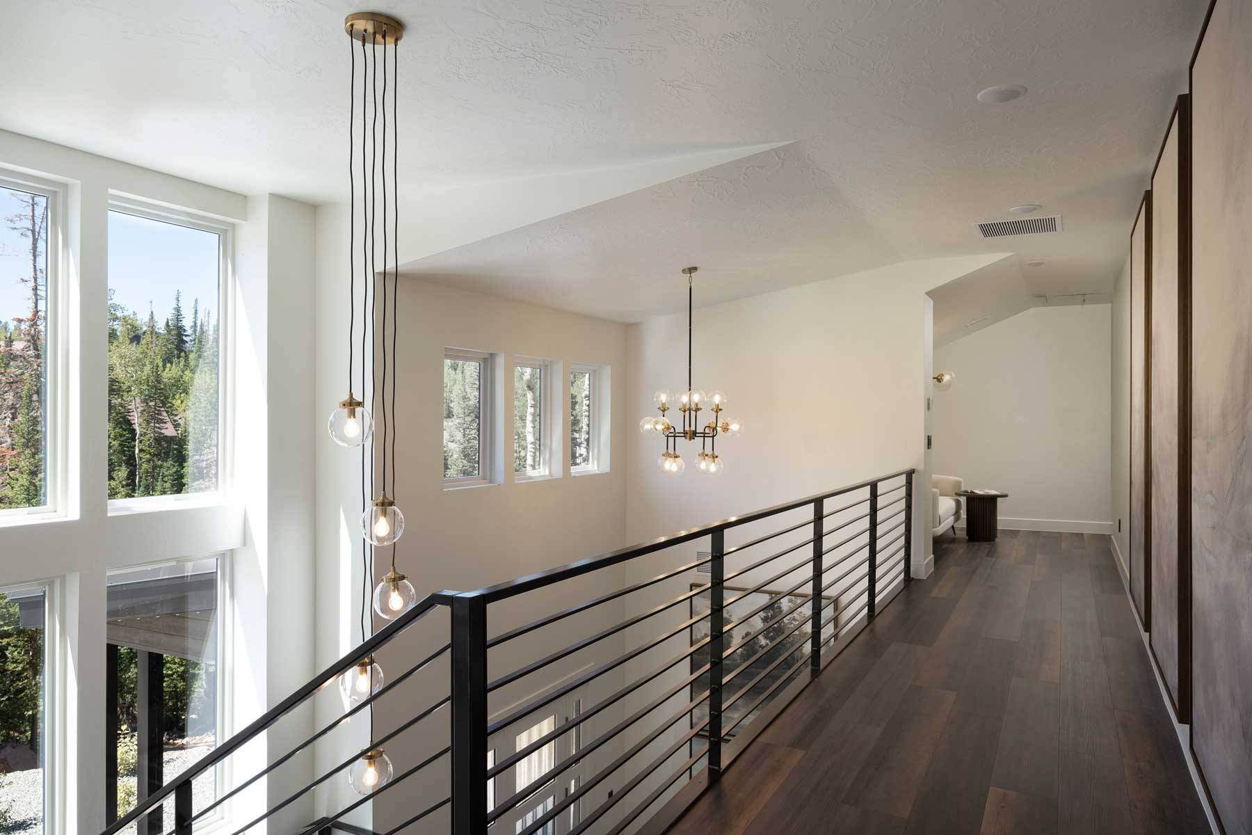 second floor loft hallway and chandelier