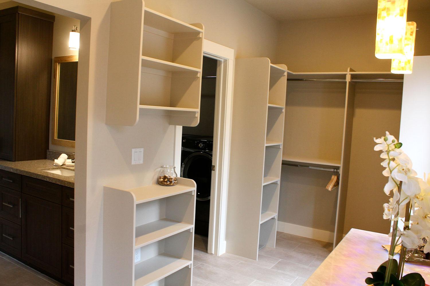 built in shelving and storage in the master bedroom walk in closet