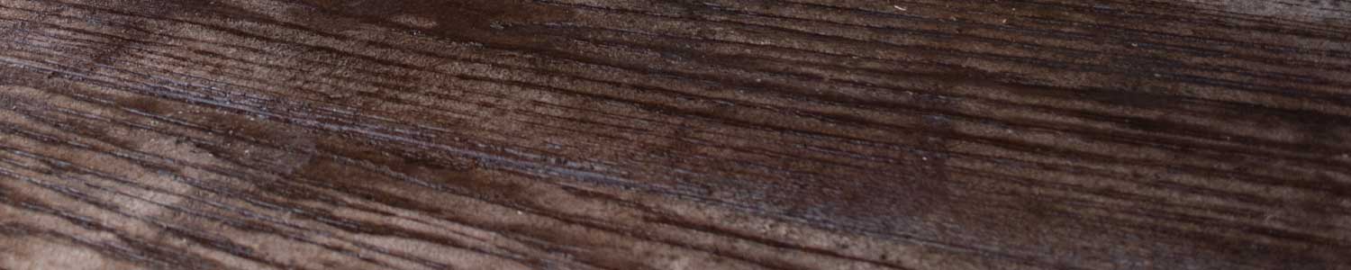 close up of hardwood flooring with dark brown stain