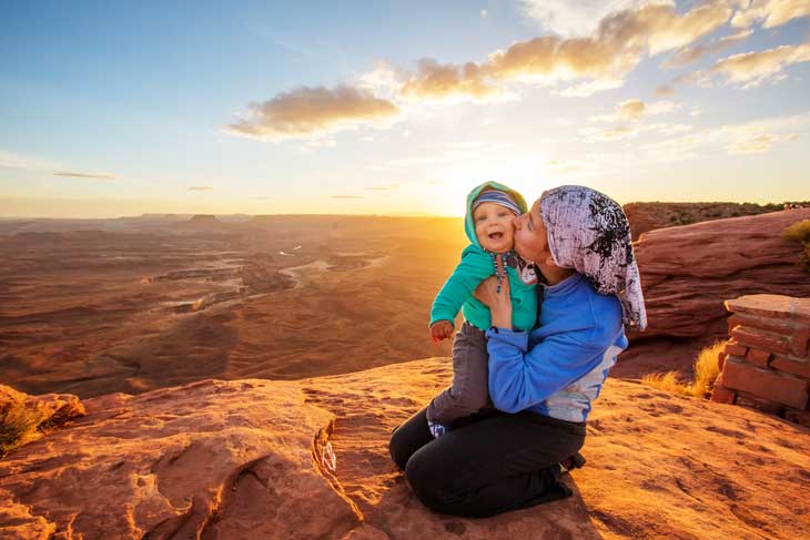  A mother and her baby son visit Canyonlands National Park in Utah