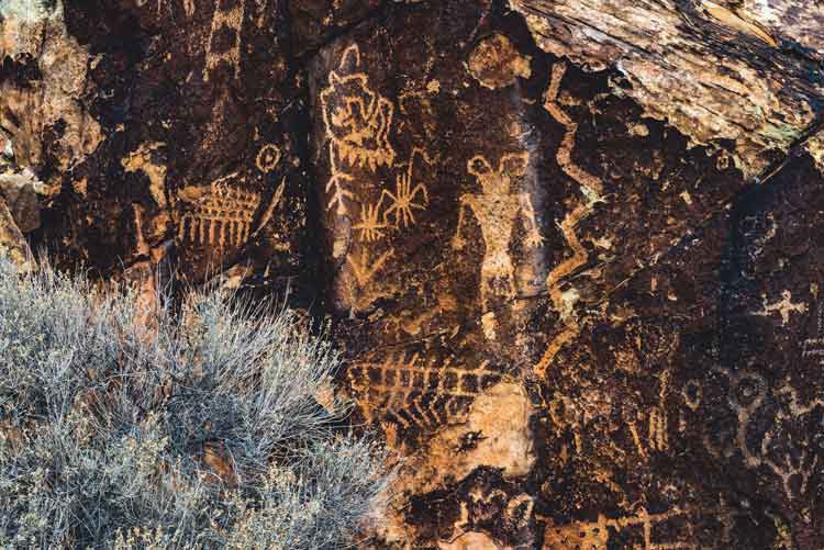 At Parowan Gap, Native American petroglyphs, or carvings, can be seen carved into Navajo sandstone petroglyphs